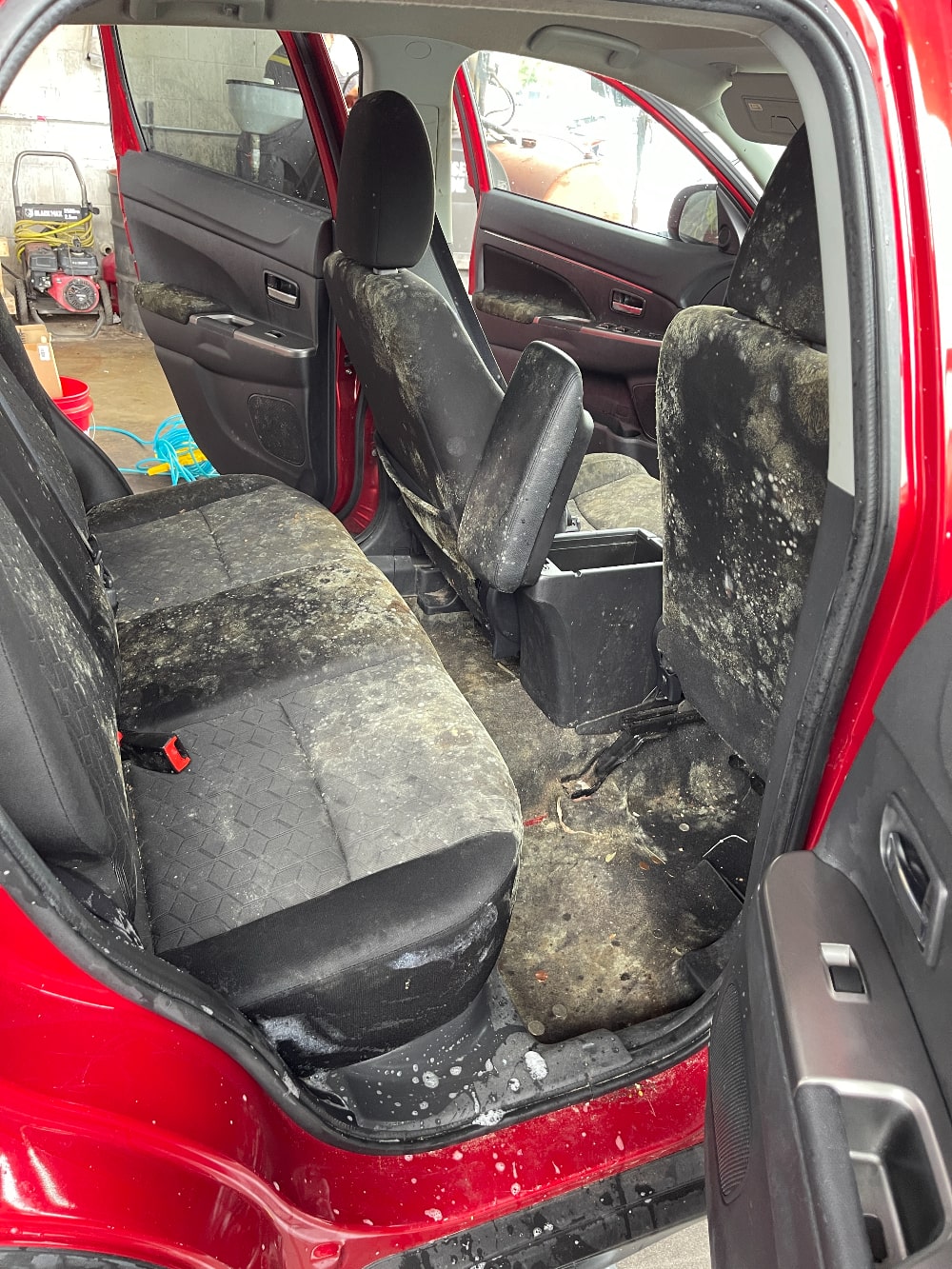 Moldy back seat before remediation